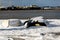 Upturned row boats have been left moored on the beach on the Suffolk coast. They have been covered in snow after a rare snow storm