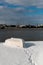 Upturned row boats have been left moored on the beach on the Suffolk coast. They have been covered in snow after a rare snow storm