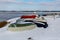 Upturned row boats have been left moored on the beach on the Suffolk coast. They have been covered in snow after a rare snow storm