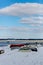 Upturned row boats have been left moored on the beach on the Suffolk coast. They have been covered in snow after a rare snow storm