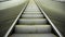 Upward movement standing on an empty escalator