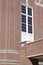 Upward view of a 20th Century brick and stone wall with beautiful architectural detail