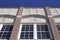 Upward view of a 20th Century brick and stone wall with beautiful architectural detail