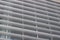 Upward view of attractive modern metal architectural louvers on a tall building