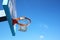 Upward view of basketball hoop against sky