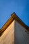 Upward View of the Corner of a Roof on a Wood Paneled Building