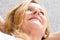 Upward view happy relaxed mature woman