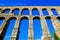 Upward view of the Roman Aqueduct of Segovia, Spain