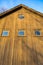 Upward view at the Top Half of a Wood Paneled Building