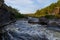 Ural Mountains. Rocks and rocky rifts on mountain river in summer. View on valley and the river Iset with rocky banks