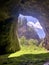 URAL, RUSSIA - August 17, 2019: Entrance to the Kapova Cave located in the Shulgan Tash Nature Reserve, Ural, Russia.