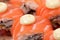 Uramaki salmon roll with scallop.