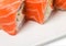 Uramaki salmon roll with scallops.