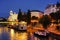 Urania Observatory building and Aspernbrucke at night, seen from Schwedenbrucke in Viena.