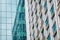 Urban abstract - Close-up of modern city glass curtain wall, windowed corner of office building