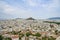 Urban Athens spreading out below with landmark Mount Lycabettus in centre of image