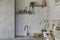 Urban chic kitchen corner with white brick wall, sink and natural decorations