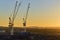 Urban cityscape with cranes in sunset, Edinburgh, Scotland, United Kingdom.