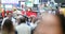 Urban crowd of anonymous commuters, unrecognizable tourists  walking in Manhattan, NYC. Times Square. Blurry Background. Traffic