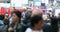 Urban Crowd of Anonymous commuters, unrecognizable tourists  walking in Manhattan, NYC. Times Square. Blurry Background. Traffic