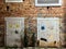 Urban Electric Conduit: Graffiti-Adorned Brick Wall