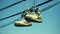 Urban Expression, Sneakers Hanging on a Telephone Wire Against the Blue Sky, Generative AI
