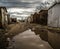 Urban Garages in Puddle Reflection