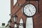 Urban historical architecture with vintage clock in street in London