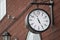 Urban historical architecture with vintage clock in street in London