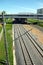 Urban industrial landscape railroad tracks and platform on sunny summer day