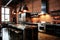 Urban kitchen with exposed brick walls. Glossy black cabinets contrast against the red brick