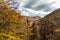 Urban landscape in autumn with large reddish trees and old stone houses. Albarracin Teruel Spain