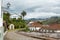 Urban landscape with cobbled street, colonial houses and mountain in the background in Ouro Preto, Brazil