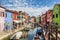 The urban landscape on the island of Burano with bright colorful buildings, Venice