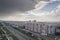 Urban landscape with a view of the avenue tratorostroiteley with the storm cloud before a strong thunderstorm. Horizontal frame.