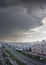 Urban landscape with a view of the avenue tratorostroiteley a storm cloud. Vertical frame. City Cheboksary, Chuvash Republic, Russ