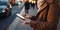 Urban life close up of girls hands with tablet outdoors