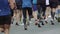 Urban Marathon runners on the street. Marathon running race. Slow motion close-up runners legs