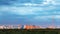 Urban panorama with blue heavy clouds over city