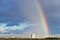 Urban panorama with rainbow