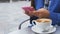 Urban professional business woman texting smart phone using app drinking coffee