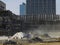 Urban renewal: excavator and dusty demolition