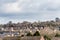 Urban scene across built up area showing the slate roof tops of terraced houses on an old housing estate in England