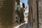 urban scene with narrow street and architecture of