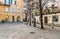 Urban scene with shops and a bars in historic center of Varese city.