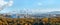 Urban skyline with new buildings and construction cranes large aerial panoramic view