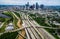 Urban Sprawl Bridge and Overpasses High Aerial Drone view over Houston Texas Urban Highway view