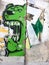 Urban street art with green dog barking