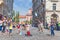 Urban street artist performing a soap bubble show for children in medieval city center of Slovenian capital Ljubljana