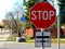 Urban street intersection. red STOP sign and bicycle route traffic sign